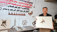 Hussein turns bullet casings into paintings calling for peace