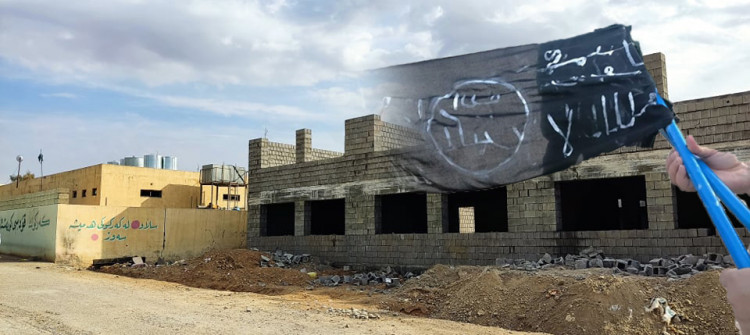 Two young men hang "ISIS flags" in Kirkuk neighborhood