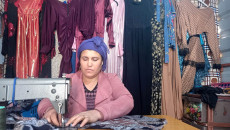 Khawla Othman stitches wounds by sewing machine