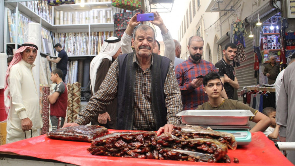 Dates seller returns to Mosul Saray Bazar following reconstruction