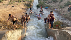 Baking summer turns Daquq irrigation into swimming pool