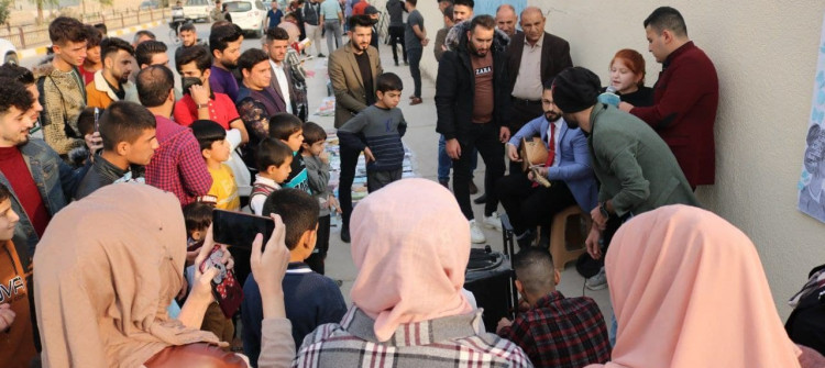 Tal Afar book sidewalk: attempt to erase destruction