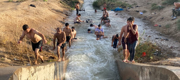 Baking summer turns Daquq irrigation into swimming pool