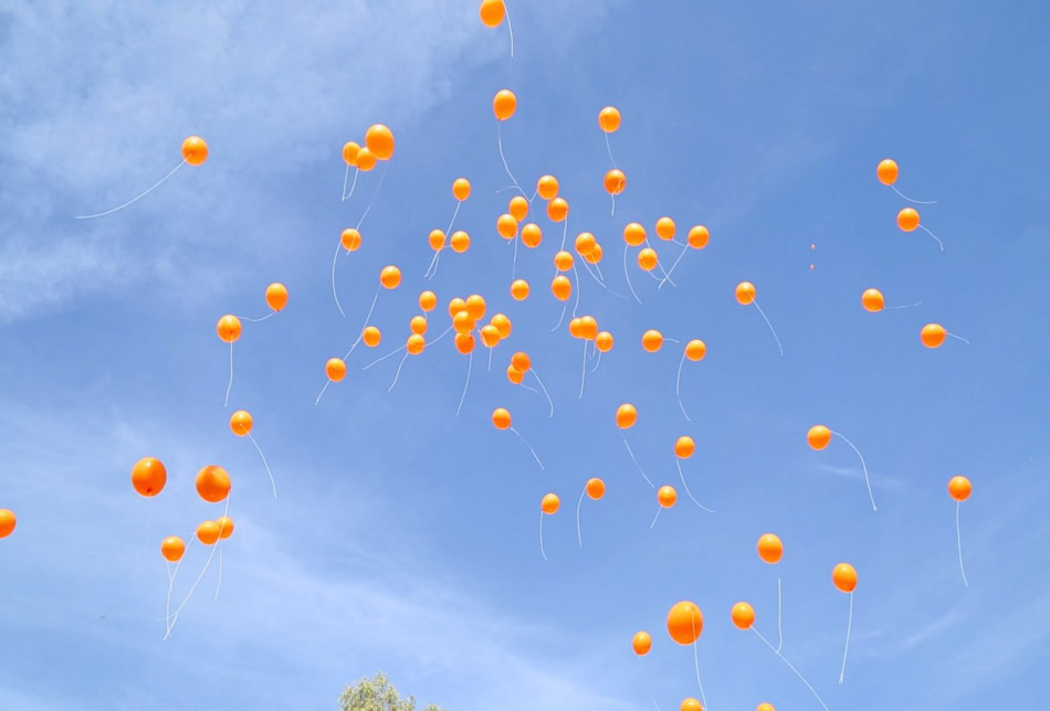 Orange balloons by women activists cover the sky of Kirkuk