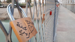 An old bridge in Mosul embraces a new tradition for lovers